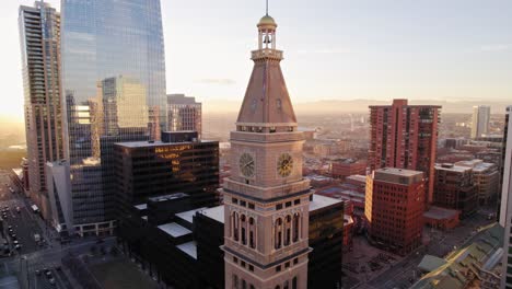 Drone-Aerial-View-Of-Lannies-Clocktower-In-Downtown-Denver-Colorado-During-Golden-Hour-Sunset