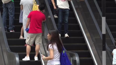 Slow-motion-of-people-who-don't-wear-surgical-mask-on-escalator