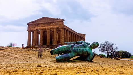 Time-lapse-shot-of-old-statue-in-front-of-Valley-of-the-Temples,-is-an-archaeological-site-in-Agrigento