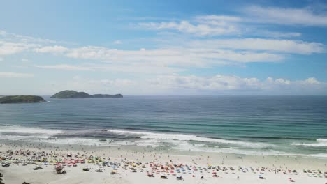 People-enjoying-spring-break-at-Praia-Do-Forte,-Cabo-Frio,-Brazil,-Aerial-view