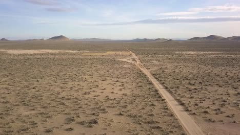 A-lonely-person-stands-all-alone-on-a-deserted-road-in-the-desert