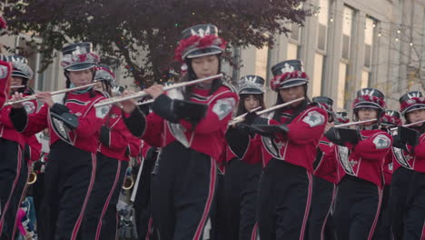 Marching-band-plays-instruments-in-Christmas-parade-in-Niagara-Falls,-Ontario