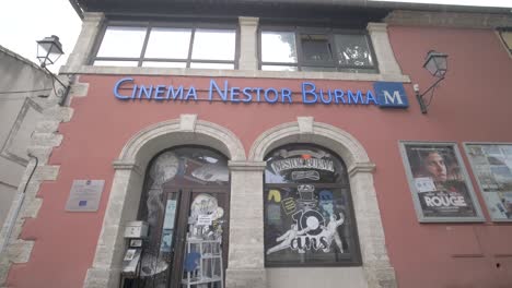 Front-entrance-of-the-Nestor-Burma-Cinema-dedicated-to-young-audiences,-Tilt-up-shot