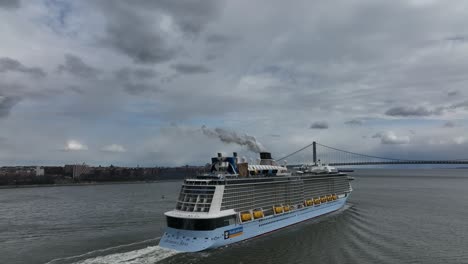 An-aerial-view-of-the-Royal-Caribbean-cruise-ship,-Anthem-of-The-Sea-leaving-Upper-Bay-heading-towards-the-Verrazano-Bridge-on-a-cloudy-day