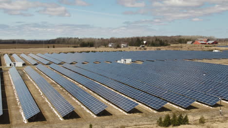A-gigantic-solar-farm-shot-from-the-the-air:-solar-panels-in-work-on-a-sunny-day