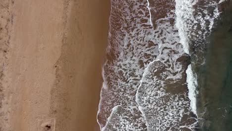 Gorgeous-aerial-drone-flight-bird's-eye-view-fly-forwards-drone-shot-of-wave-cost-line-shore