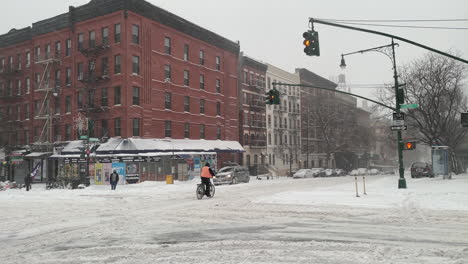Bicyclist-Rides-On-Slippery-New-York-City-Street-In-Heavy-Snow