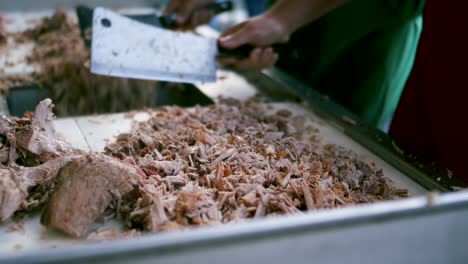 Tight-shot-of-chopping-pulled-pork-BBQ