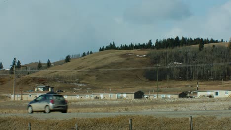 Affordable-housing-in-rural-area-car-passing-by