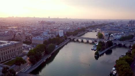 Descending-drone-flying-over-Seine-river-in-Paris-towards-Ile-de-la-Cite-and-La-Samaritaine-in-reconstruction