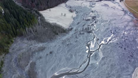 Frozen-river-delta-in-a-valley-during-winter