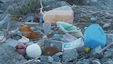 Plastic-rubbish-waste-washed-up-on-island-shoreline
