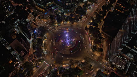 Mexico-City-Aerial-v3-hyperlapse-birds-eye-view-of-illuminated-angel-of-independence-with-busy-roundabout-traffics-and-futuristic-downtown-night-cityscape---Shot-with-Mavic-3-Cine---December-2021