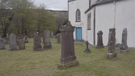 Close-up-of-old-gravestones-at-Kilmorich-Church,-Cairndow