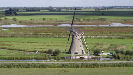 Drone-downward-crane-motion-of-rural-Dutch-windmill-used-to-control-water-level