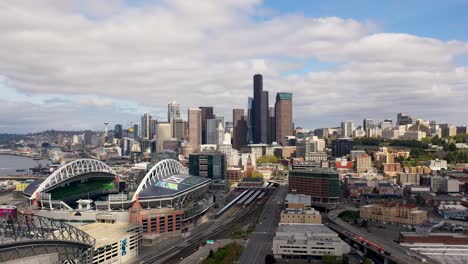 Aerial-time-lapse-of-Seattle's-stadium-district-with-clouds-casting-large-shadows-over-the-city