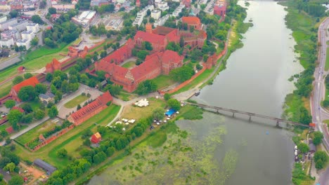 Aerial-view-of-Castle-of-the-Teutonic-Order-in-Malbork,-Malbork-,-largest-by-land-in-the-world,-UNESCO-World-Heritage-Site,-Poland