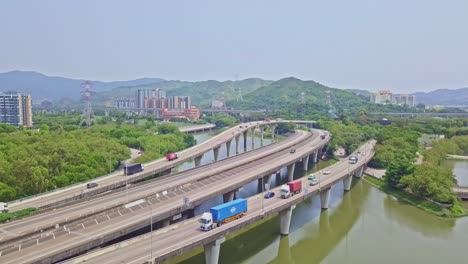 A-dynamic-ascending-aerial-footage-of-the-highway-above-waters-in-Yuen-Long-in-Hong-Kong