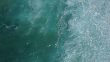 Stunning-aerial-top-down-ocean-water-abstract-and-foam