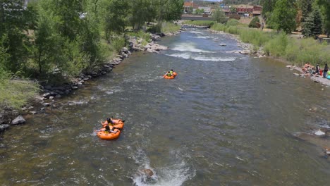 People-rafting-down-the-San-Juan-river-in-Pagosa-Springs,-CO