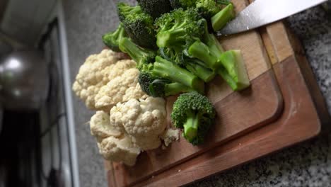 Organic-Vegetables-With-Fresh-Cauliflower-And-Broccoli-Chopped-In-Wooden-Board
