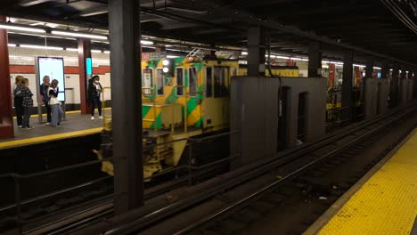Maintenance-Car-train-passing-in-new-york-city-subway-station,-wide