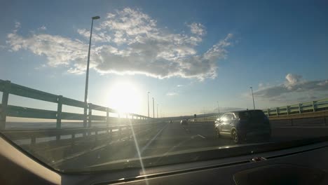Timelapse-Hyperlapse-Dashcam-Car-Footage-Across-Severn-Prince-of-Wales-Bridge-in-Wales-From-England-on-M4-with-Sun-Flare-UK-4K