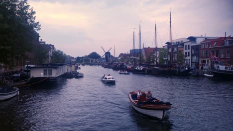 View-of-two-boats-sailing-and-passing-by-in-Leiden-canals