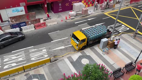 truck-with-gas-cylinders-making-a-dangerous-turn-downtown-Singapore