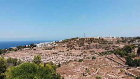 Scenic-aerial-view-of-dry-mediterranean-fields-from-Gharghur-Top-of-the-World-in-Malta