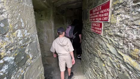 Family-descending-stone-steps-at-Harlech-Castle