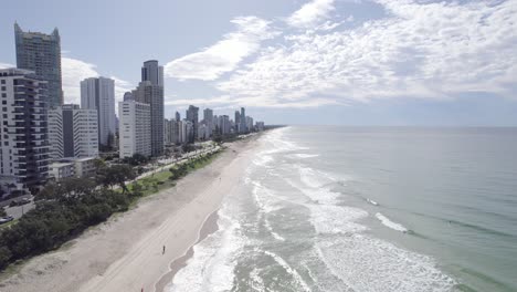 Flying-On-The-Sandy-Beach-With-Coastal-Road-At-The-Surfers-Paradise-In-Gold-Coast,-Queensland,-Australia