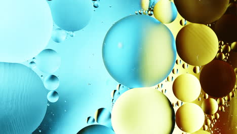 Real-close-up-oil-bubbles-in-water-rotation-with-color-gradient-abstract-mixing-background