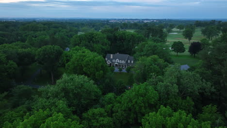 Aerial-view-of-an-estate-on-large-plot-of-land-near-a-country-club