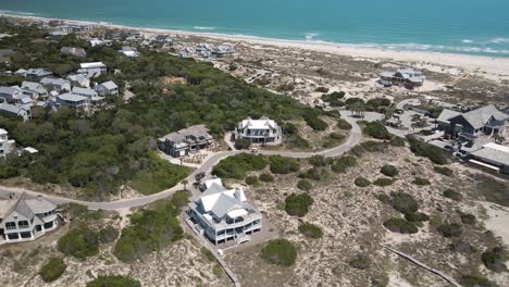 Bald-Head-Island-beachfront-properties-wide-aerial-ascending-to-two-story-apartment