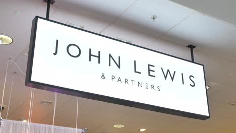 Canary-Wharf-London-United-Kingdom-July-2022-Establishing-shot-of-the-John-Lewis-and-Partners-logo-in-the-store