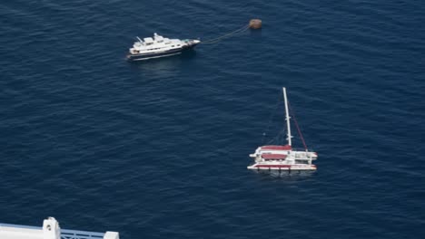 Boats,-anchored,-cliff,-Fira,-white-buildings,-birds-flying,-ocean,-exotic,-Santorini,-island,-Greece