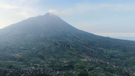 Serene-Wonolelo-village-on-slope-of-Mount-Merapi-volcano-Java,-Indonesia,-aerial-panorama