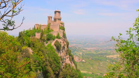 Dense-Foliage-At-Mount-Titano-With-The-Three-Towers-Of-San-Marino-In-Italy