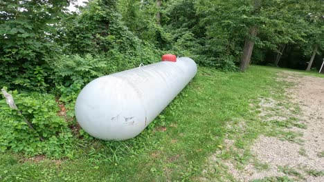 View-of-1000-gallon-LP-tank-in-a-yard-of-a-rural-home