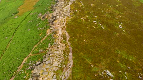Aerial-Birdseye-view-above-rocky-Stanage-edge-untouched-Peak-district-gritstone-escarpment-terrain