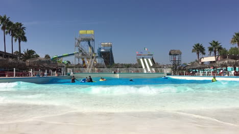 People-in-wave-pool-at-a-water-park-in-slow-motion
