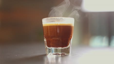Espresso-shots-being-poured-into-glass-with-steam