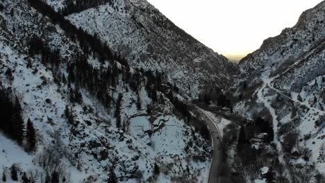Drone-footage-in-snowy-mountains-as-sun-goes-down