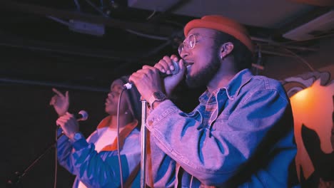 TROOP-Atlanta,-GA---December-15,-2018:-A-pair-of-young-African-American-rappers,-Troop-Brand,-perform-in-a-hip-hop-duo-at-a-lively-concert-in-an-underground-urban-nightclub-popular-with-millennials