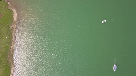 Aerial-Top-Downshot-of-boats-on-lake-water