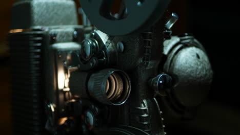 Moody-close-up-of-an-old-8mm-projector,-shallow-depth-of-field-and-high-contrast