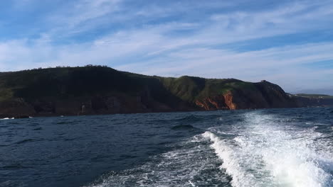 The-view-from-a-small-vessel-cruising-past-the-southern-Cape-coast-near-the-Knysna-Heads-on-the-Indian-ocean