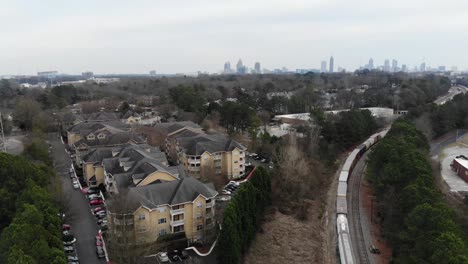 Atlanta-skyline-reveal.-Moving-train-near-apartments