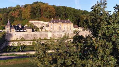 AERIAL:-Shot-of-Chateau-Neercanne-bathing-in-the-morning-sun